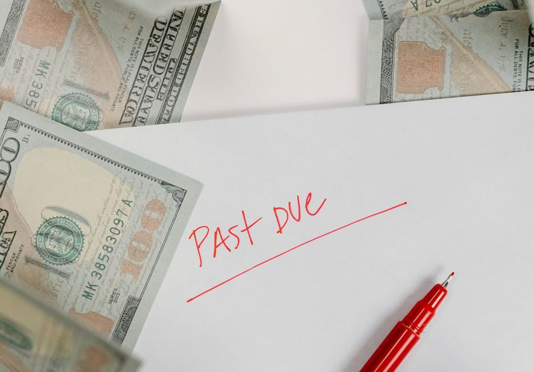 A red pen lies on paper with 