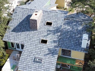 An aerial view of a house with a roof that is being built.