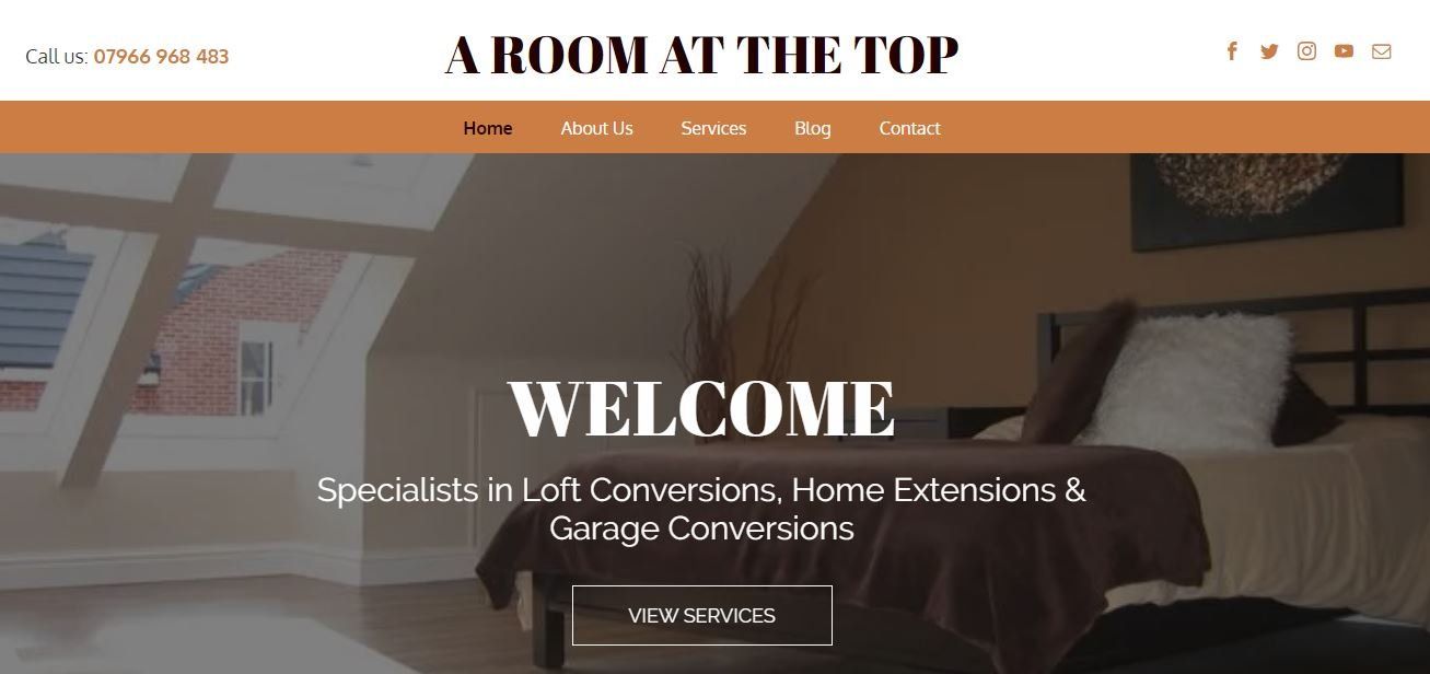 A room at the top website shows a bedroom with a bed and a window.