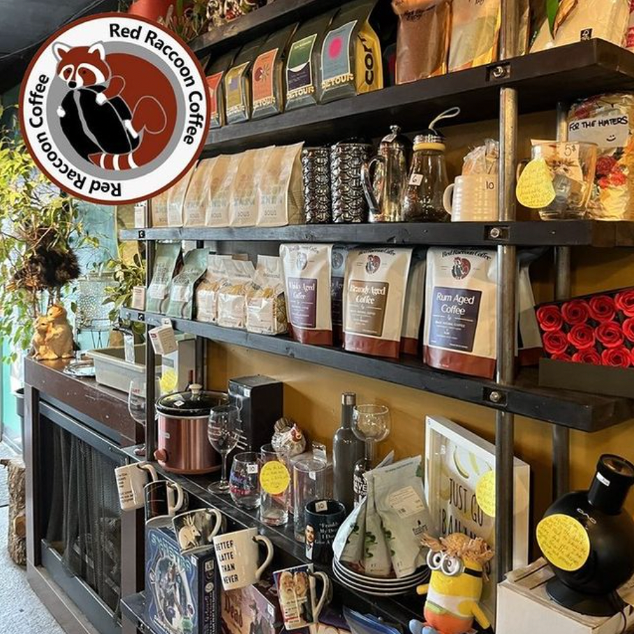 A store filled with shelves filled with bags of coffee and other items.
