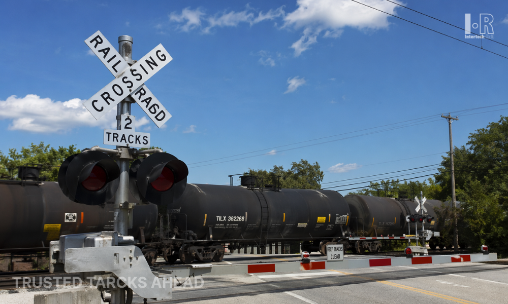 Railway crossing system with barriers and warning signals in operation