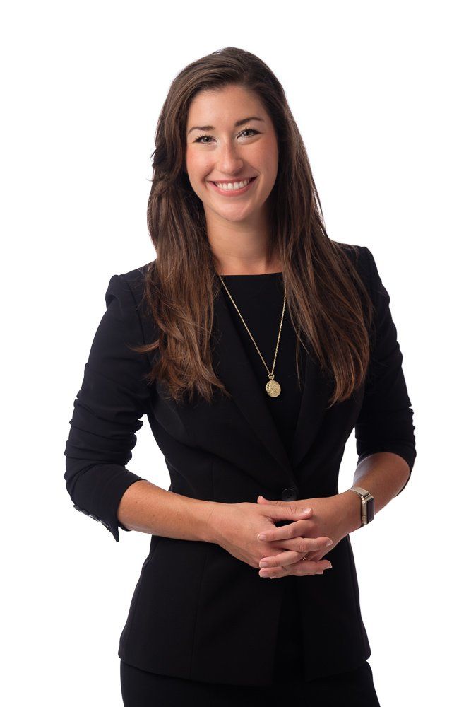 Professional photograph of Professor Poole in a black dress suit