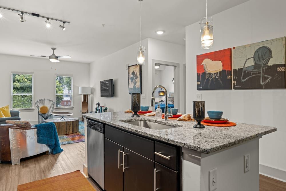Spacious open flor plan with kitchen oversees living room at Skyline West in Atlanta, GA.