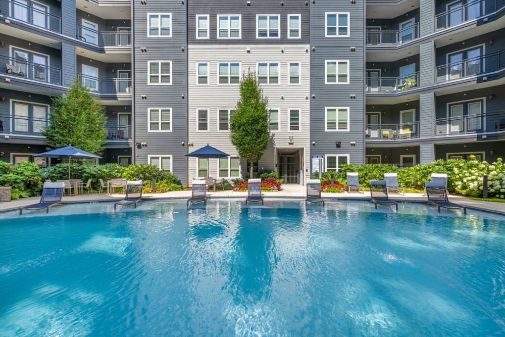 A large swimming pool in front of an apartment building at Skyline West in Atlanta, GA.