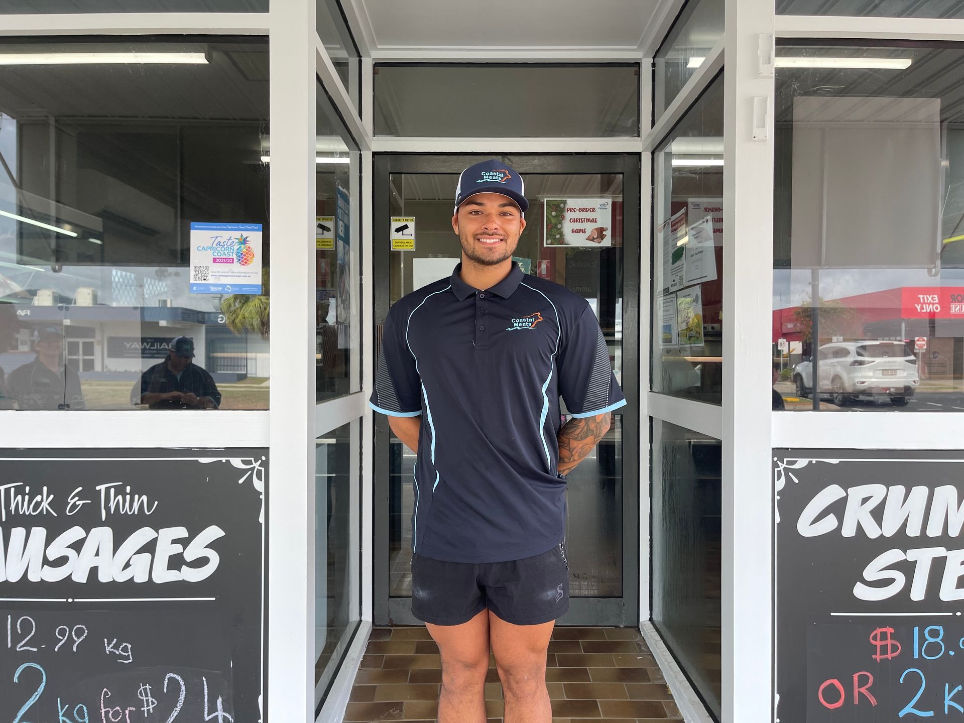 Man Standing in the Doorway of a Store Wearing a Uniform — Coastal Meats in Yeppoon, QLD