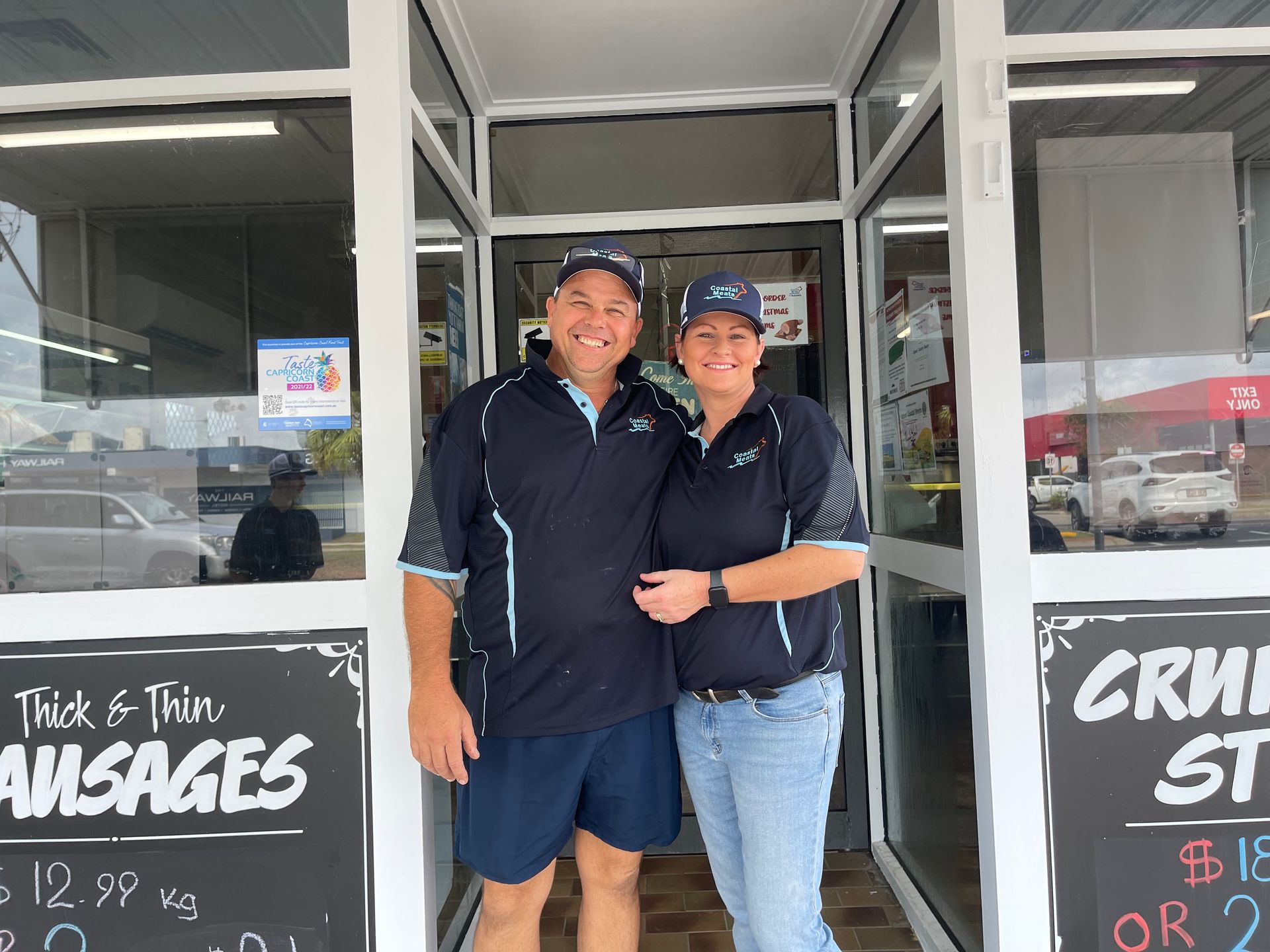 Two People, a Man and a Woman, Stand in the Doorway of a Shop — Coastal Meats in Yeppoon, QLD
