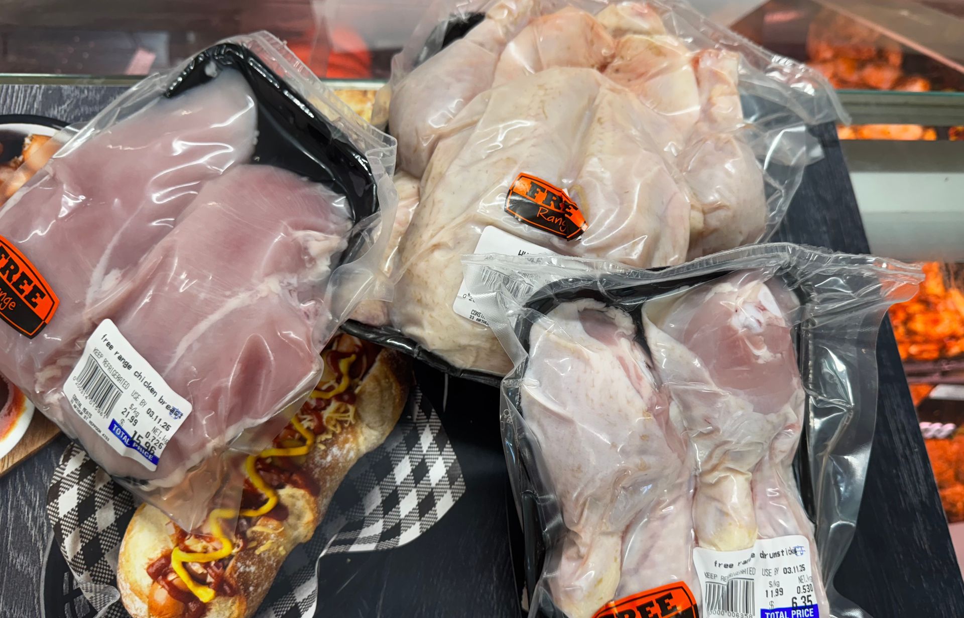 Packaged raw chicken breasts, whole chicken, and drumsticks in a supermarket display — Coastal Meats in Yeppoon, QLD