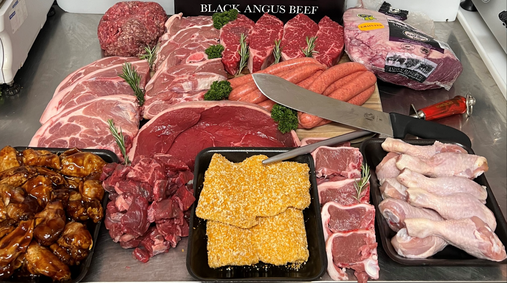 Showcasing Various Cuts of Raw Meat, Including Steaks, Sausages, and Chicken — Coastal Meats in Yeppoon, QLD