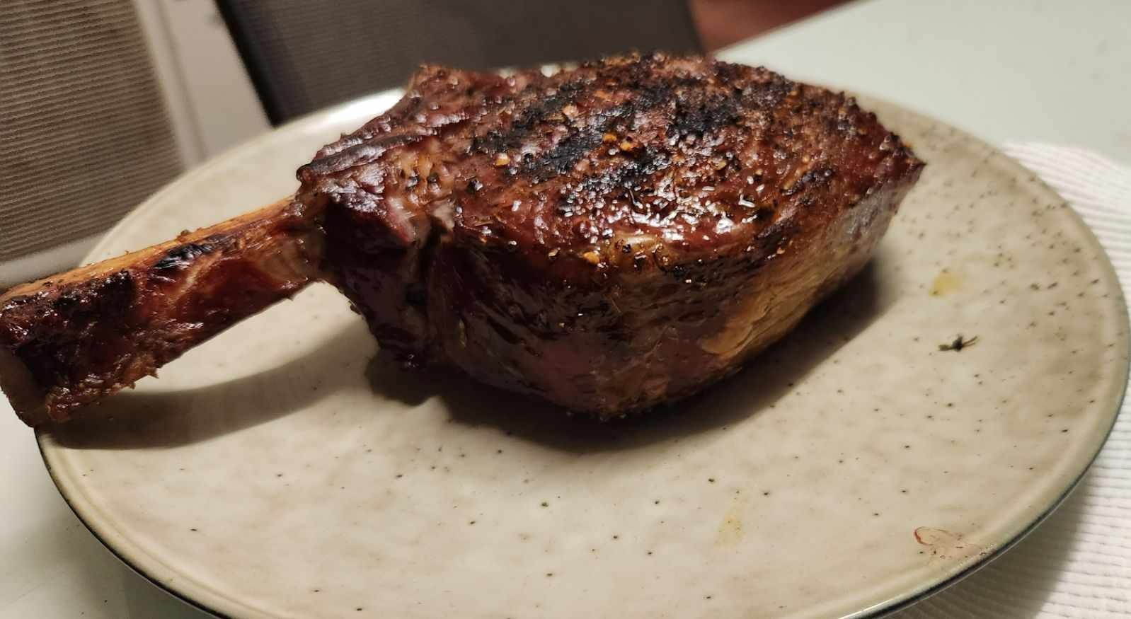 A Large Piece of meat Is on a White Plate — Coastal Meats in Yeppoon, QLD