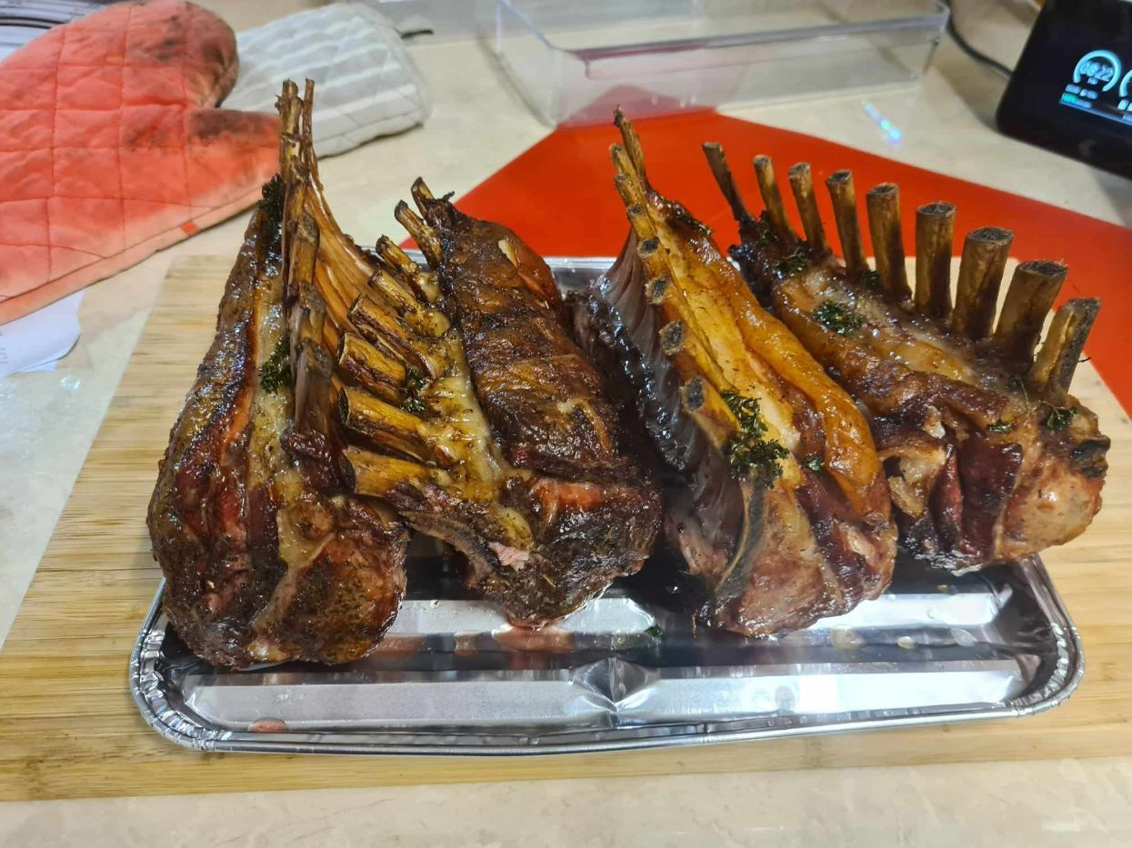 A Tray of Lamb Chops Rests on a Wooden Cutting Board — Coastal Meats in Yeppoon, QLD