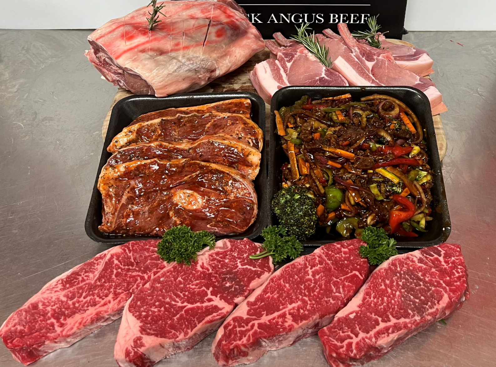 Assortment Raw Meat: Lamb Roast, Pork Chops, Marinated Lamb Steaks, Stir-fry, and Beef Steaks — Coastal Meats in Yeppoon, QLD