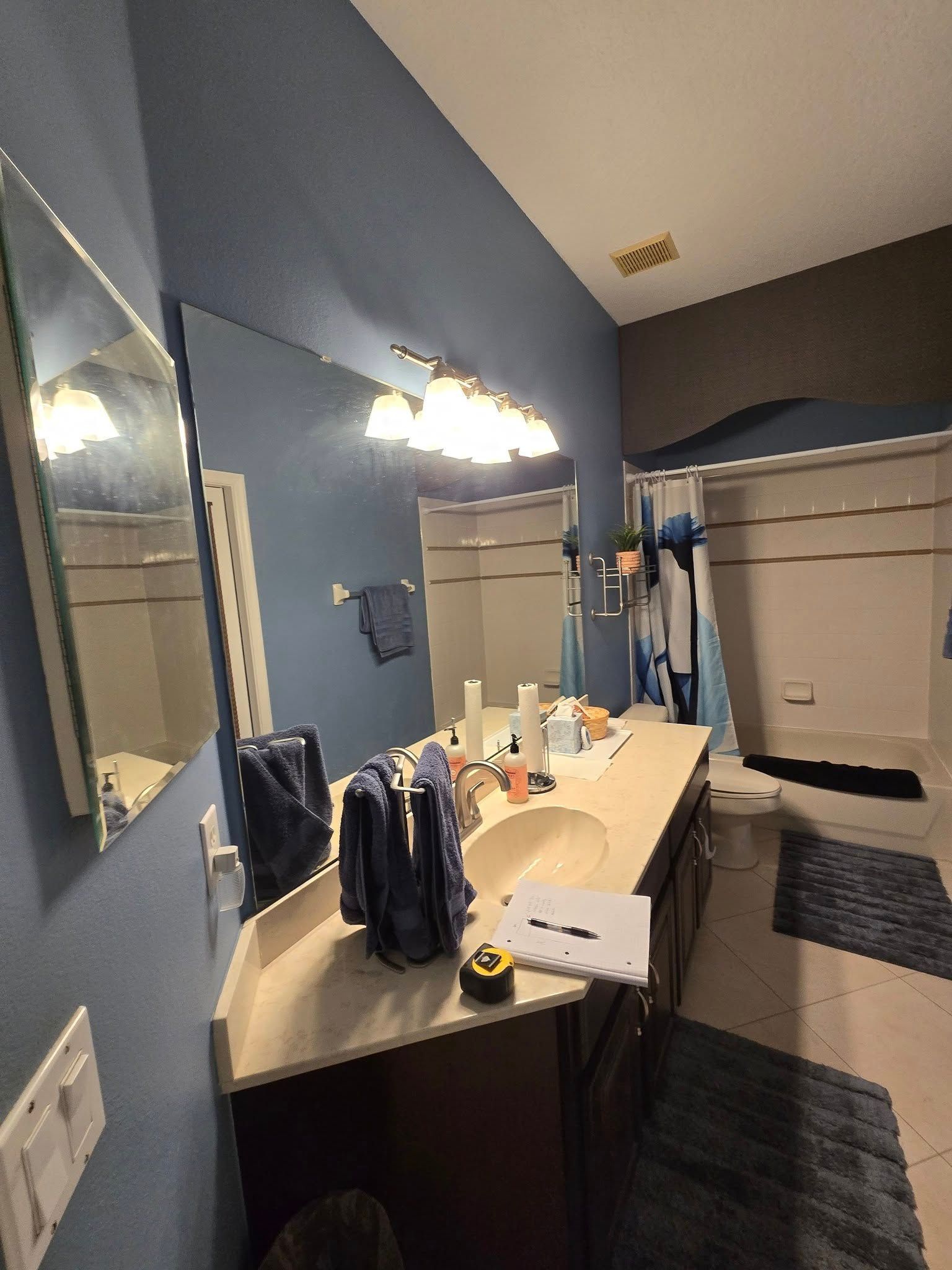 A bathroom with two sinks and two mirrors