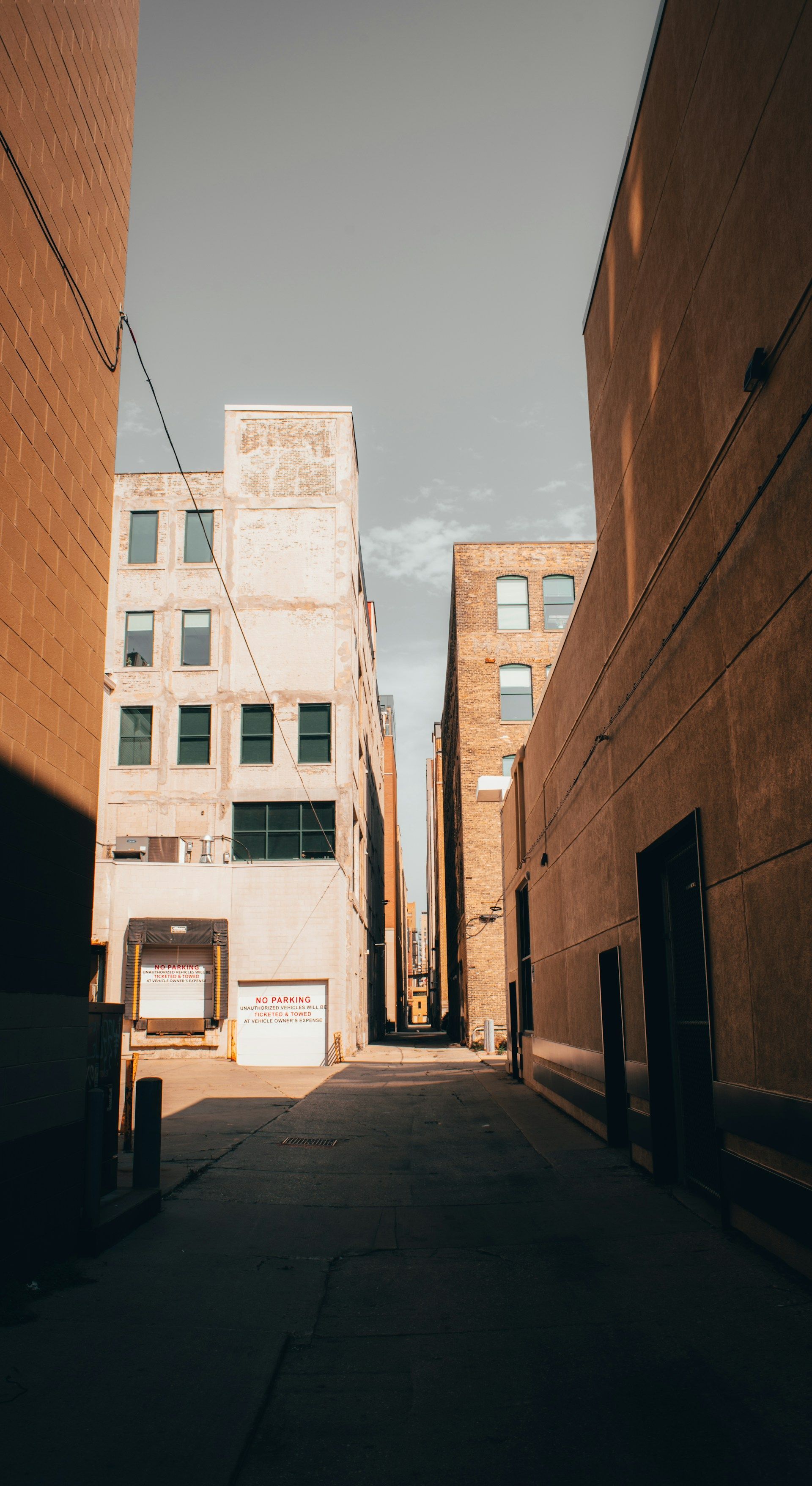 Aerial view of a large church with a teal dome, overlooking a city street with buildings and trees.