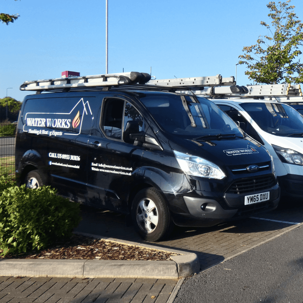 Waterworks Services Vans lined up with 'Plumbing & Heating Experts' strapline