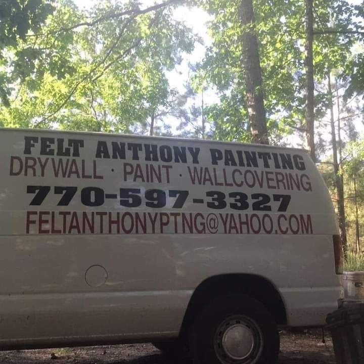 A white van advertises felt anthony painting drywall paint and wallcovering