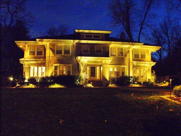 A large house that is lit up at night