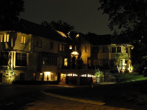 A row of houses are lit up at night