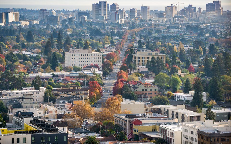 An aerial view of a city with lots of buildings and trees