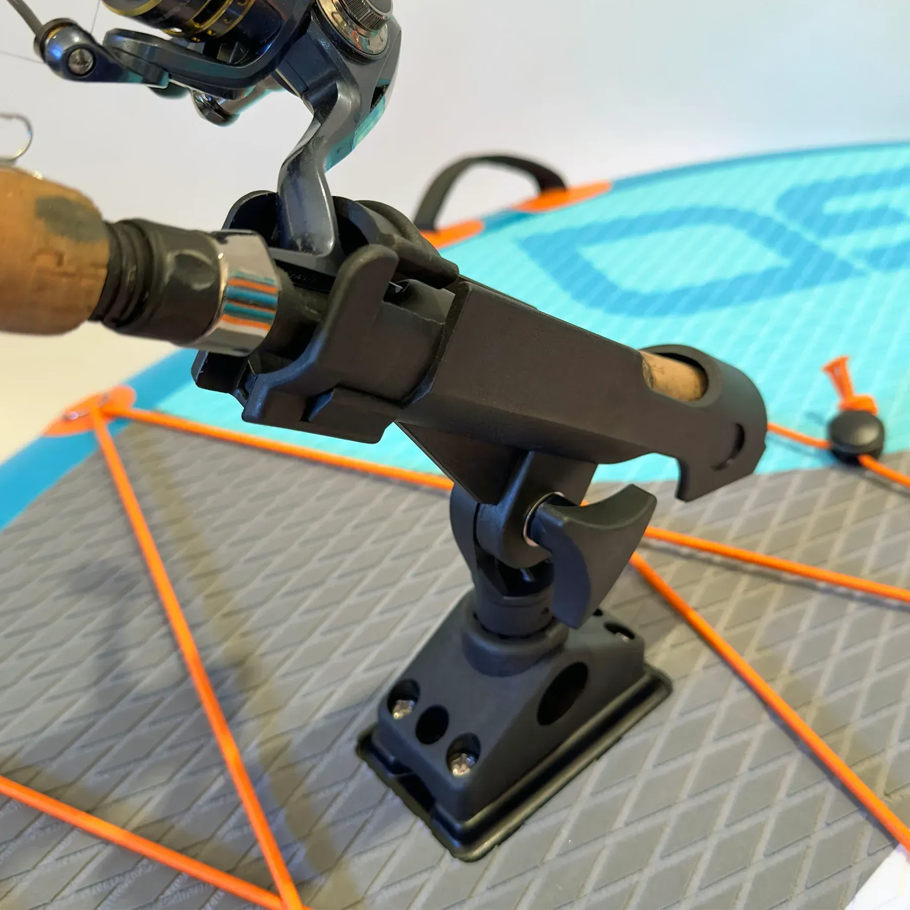 A fishing rod is attached to a fishing rod holder