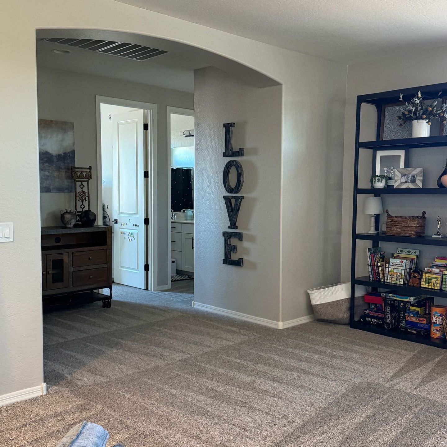 A living room with the word love on the wall