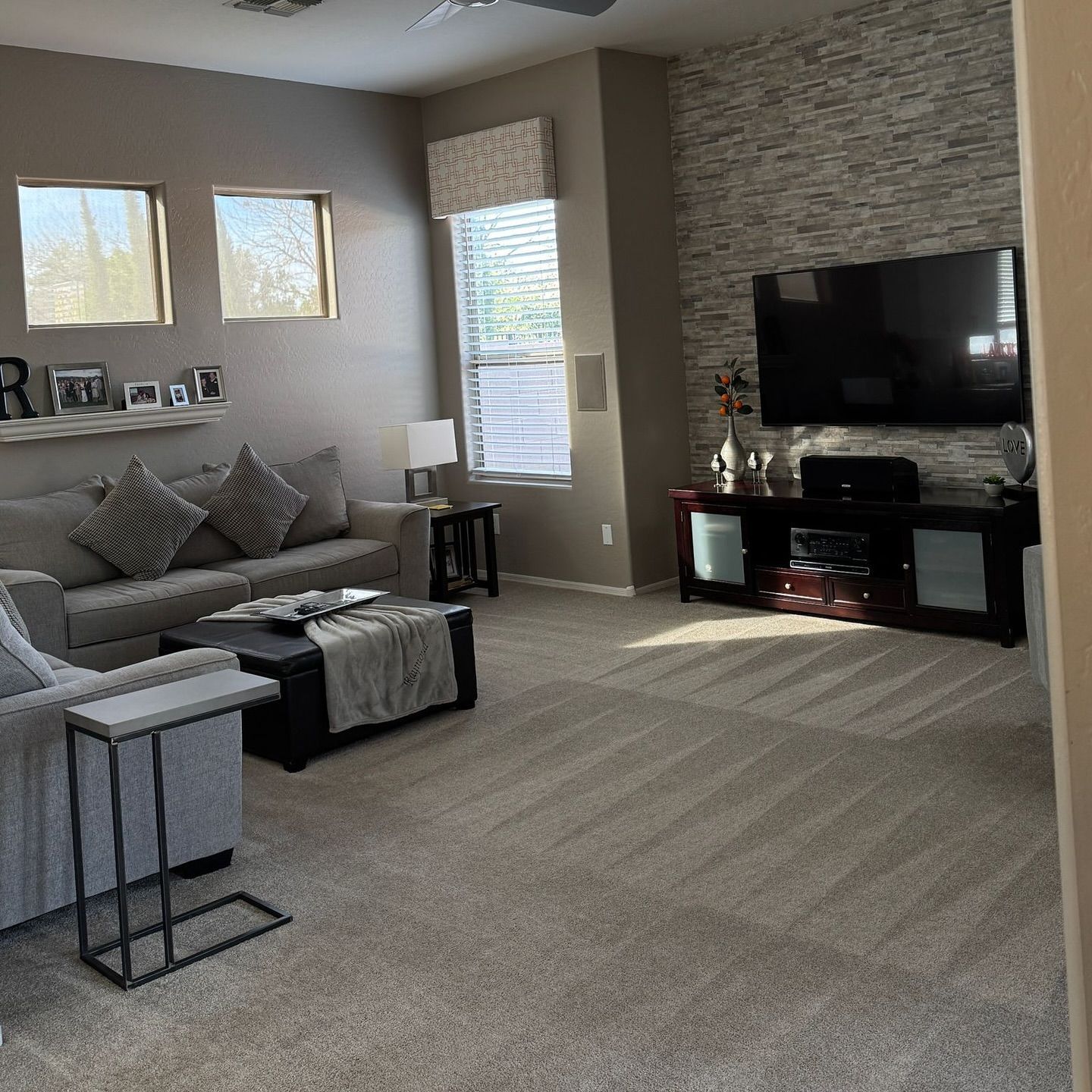 A living room with a couch and a flat screen tv