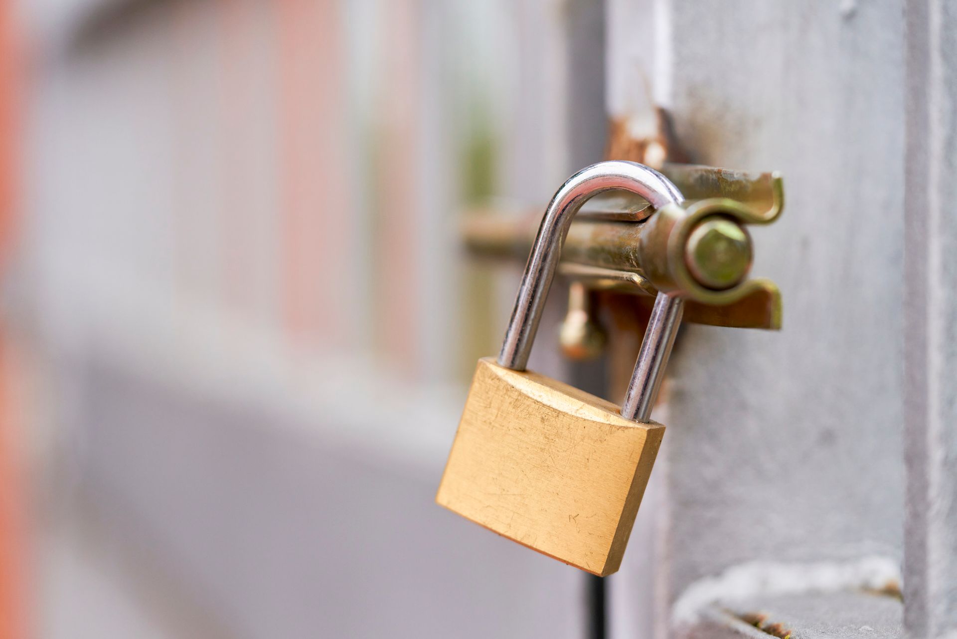 A close up of a padlock on a door.