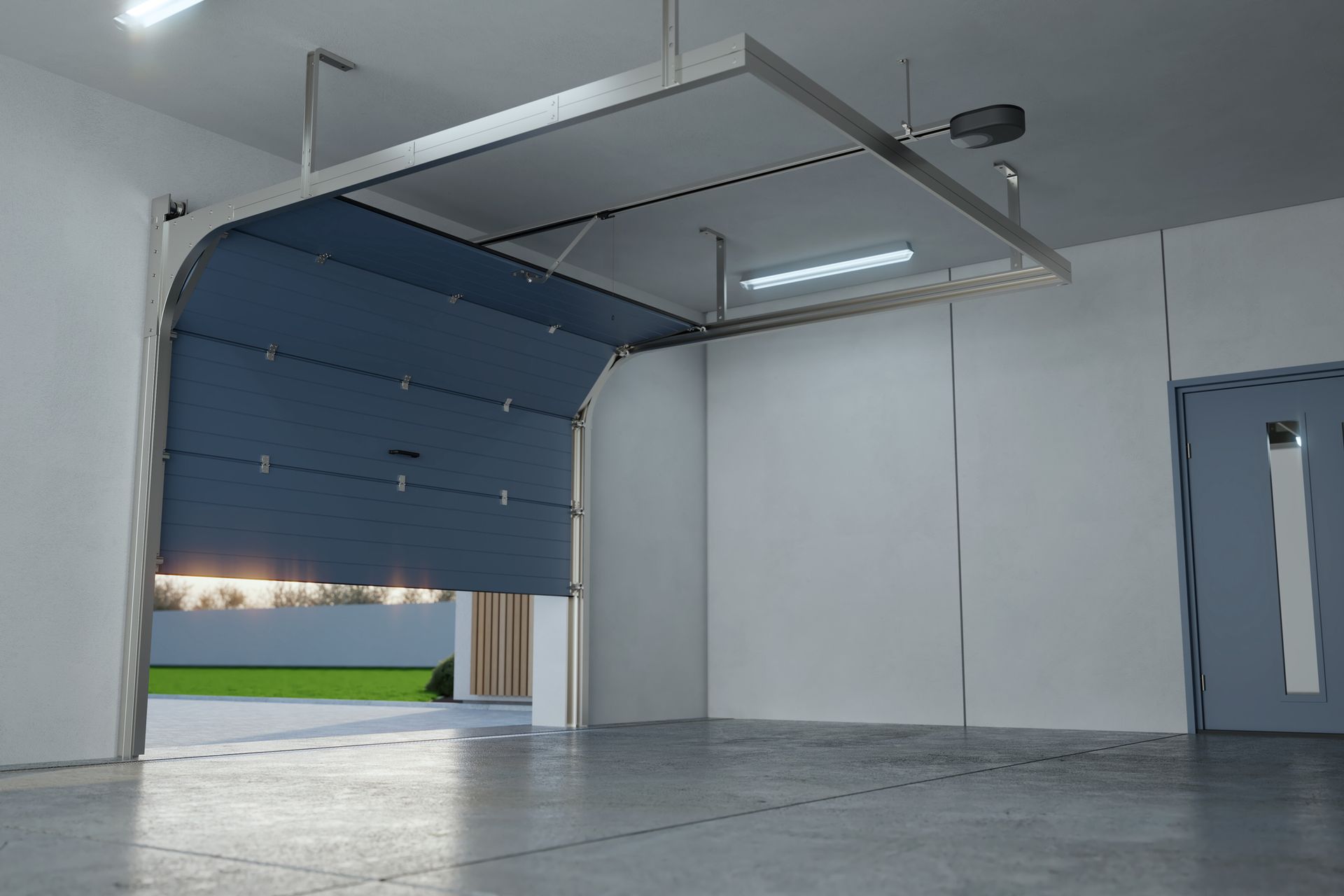 An empty garage with a blue garage door open.