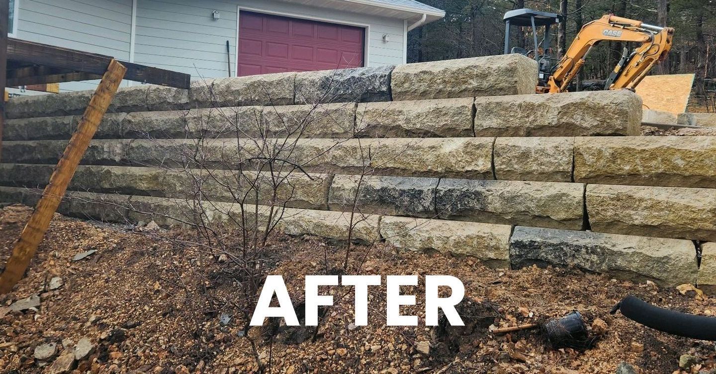 After image when rough cuts construction finished replacing the retaining wall with natural stone.