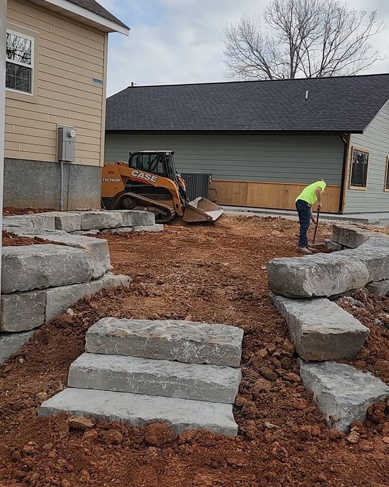Hand holding trowel leveling out concrete work.
