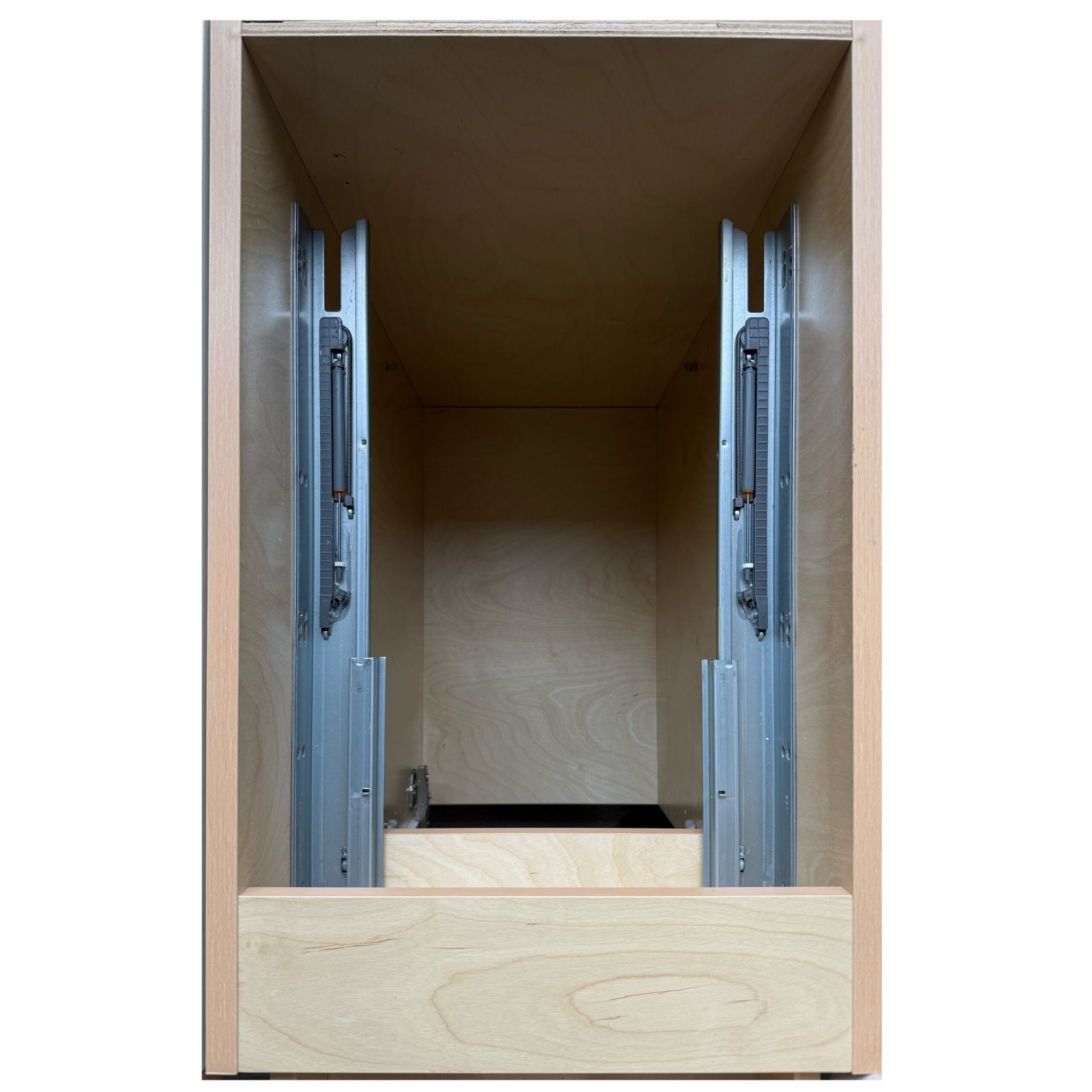Cabinet interior with installed drawer slides. Light wood, open space.