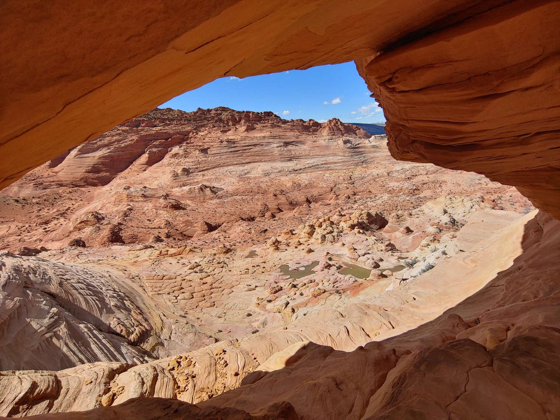 A view of a desert landscape from a cave