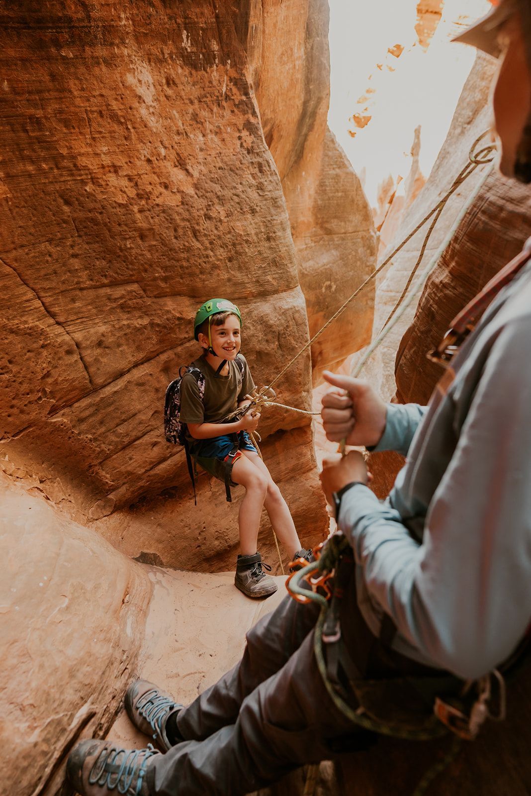 a young boy learning how to a person canyoneer