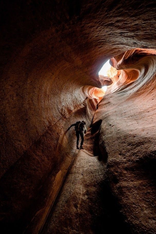 Rappelling deep into a slot canyon