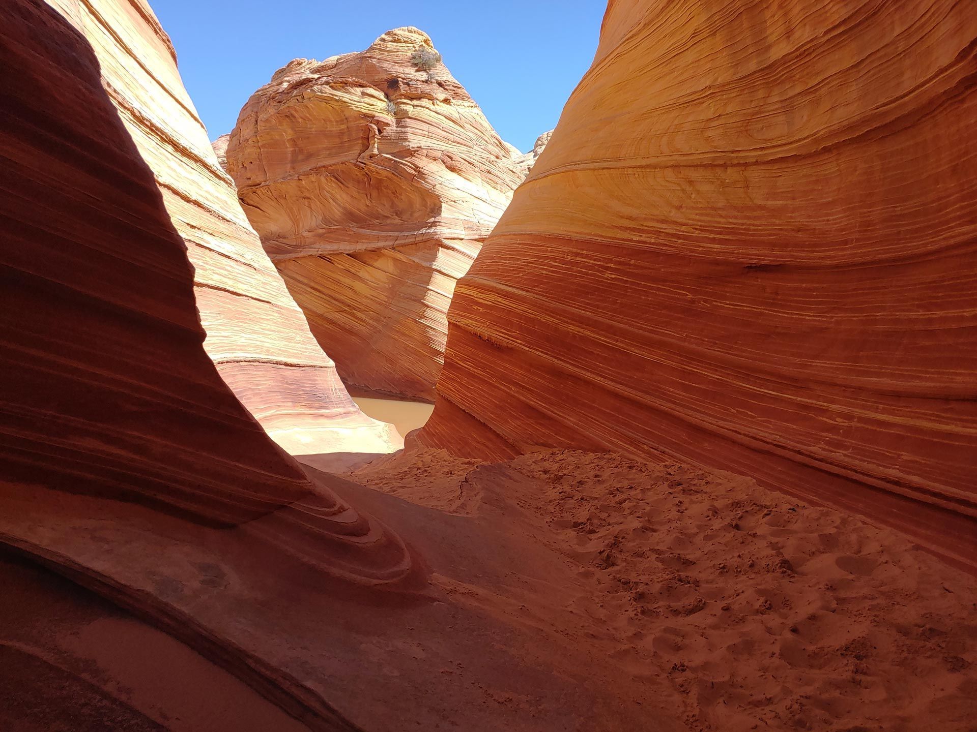 A canyon with a blue sky in the background