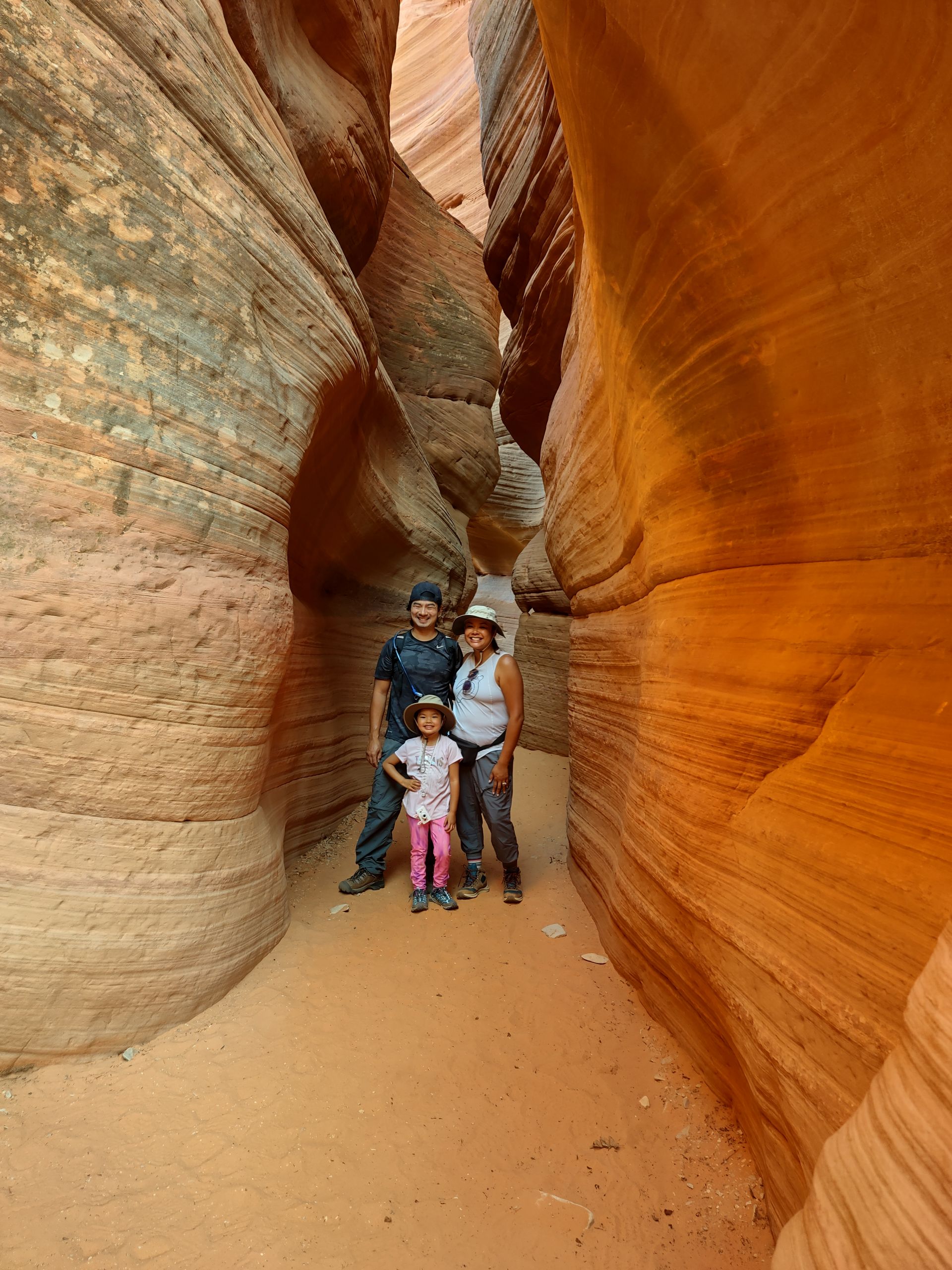 Family taking a picture under canyon