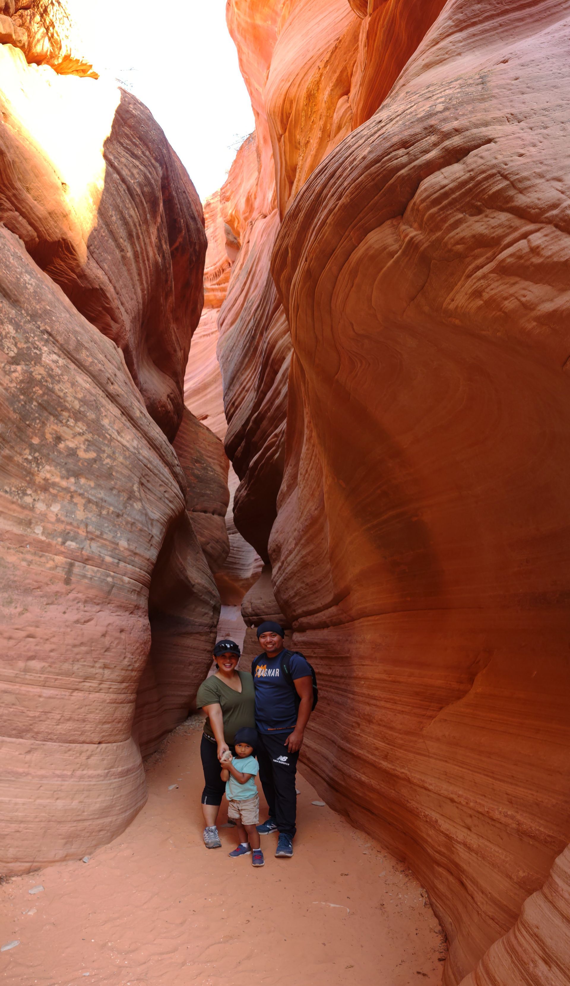 The glowing, orange sandstone walls of Peek-A-Boo Slot Canyon near Kanab, Utah, during a private guided tour with All Ways Adventure.
