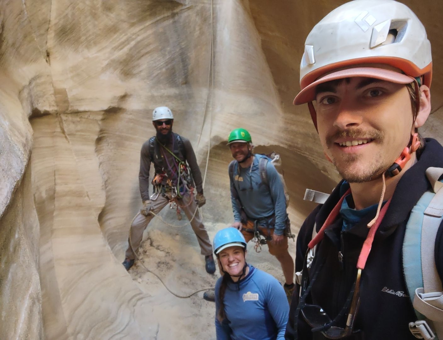 Darren, Brett, Jillian, and Nathan pose for a selfie in a slot canyon