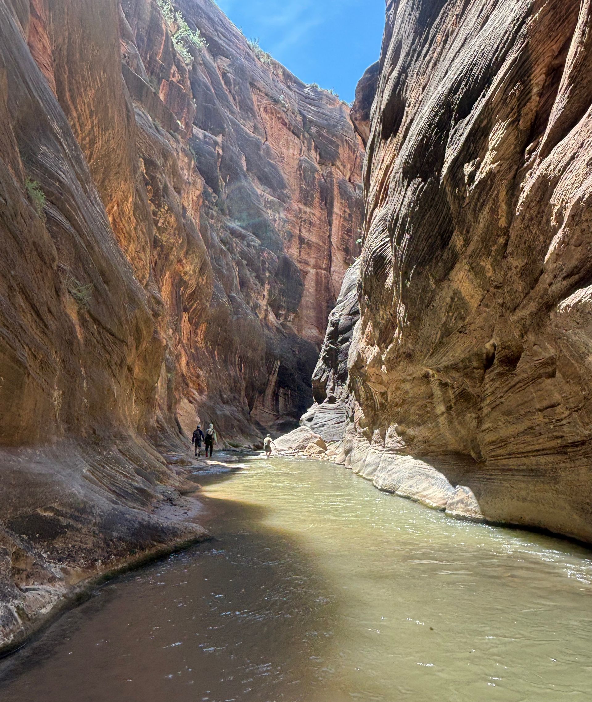 A river runs through a canyon between two cliffs.