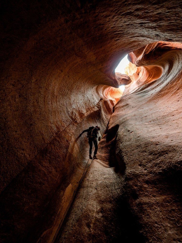 A cave with a light coming out of it