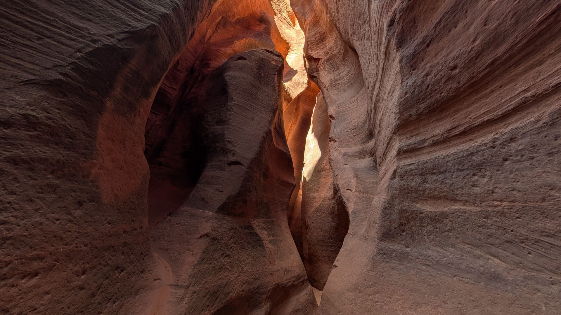 The inside of an orange colored slot canyon in Southern Utah