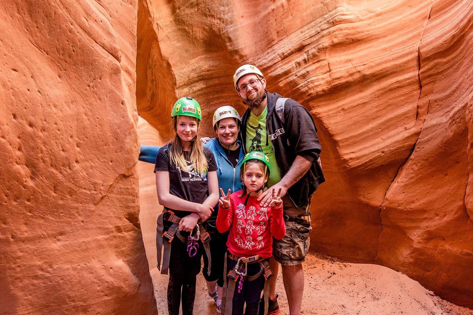 A family is posing for a picture in a canyon