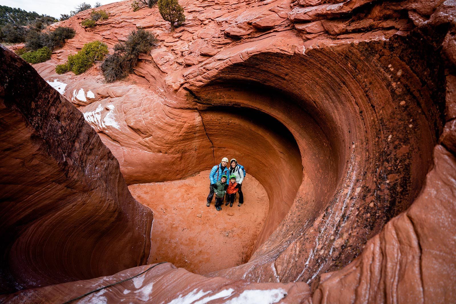 A Man Is Climbing up A Rock Wall