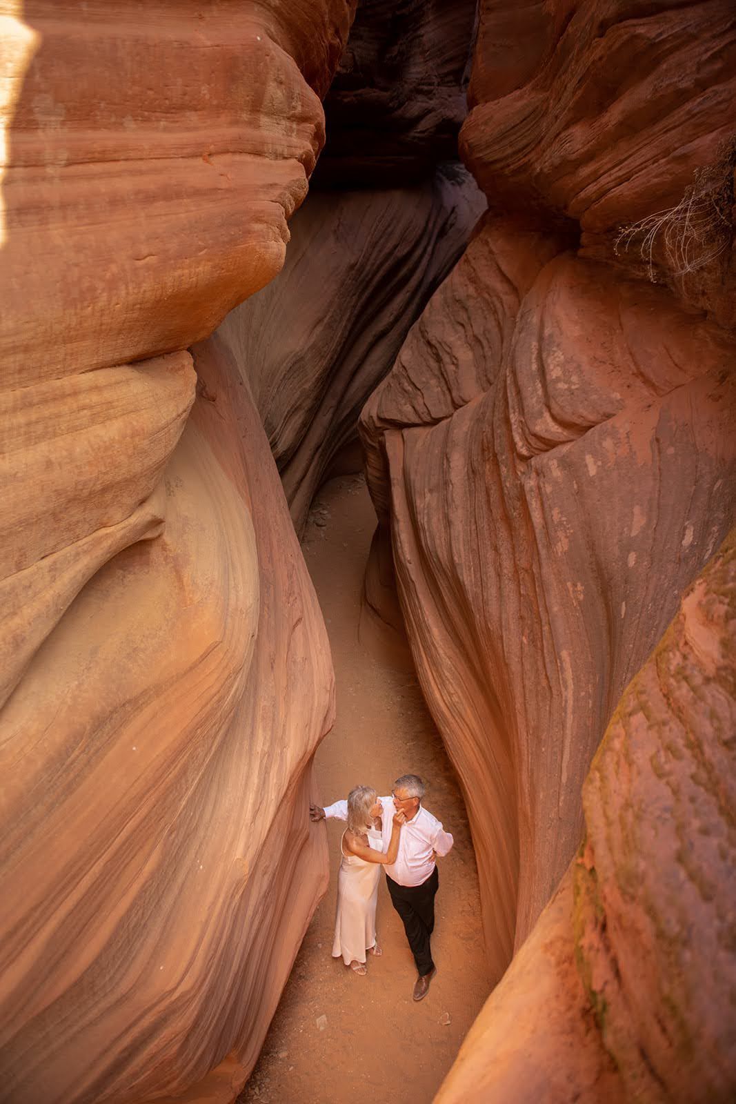 two people in a canyon getting married