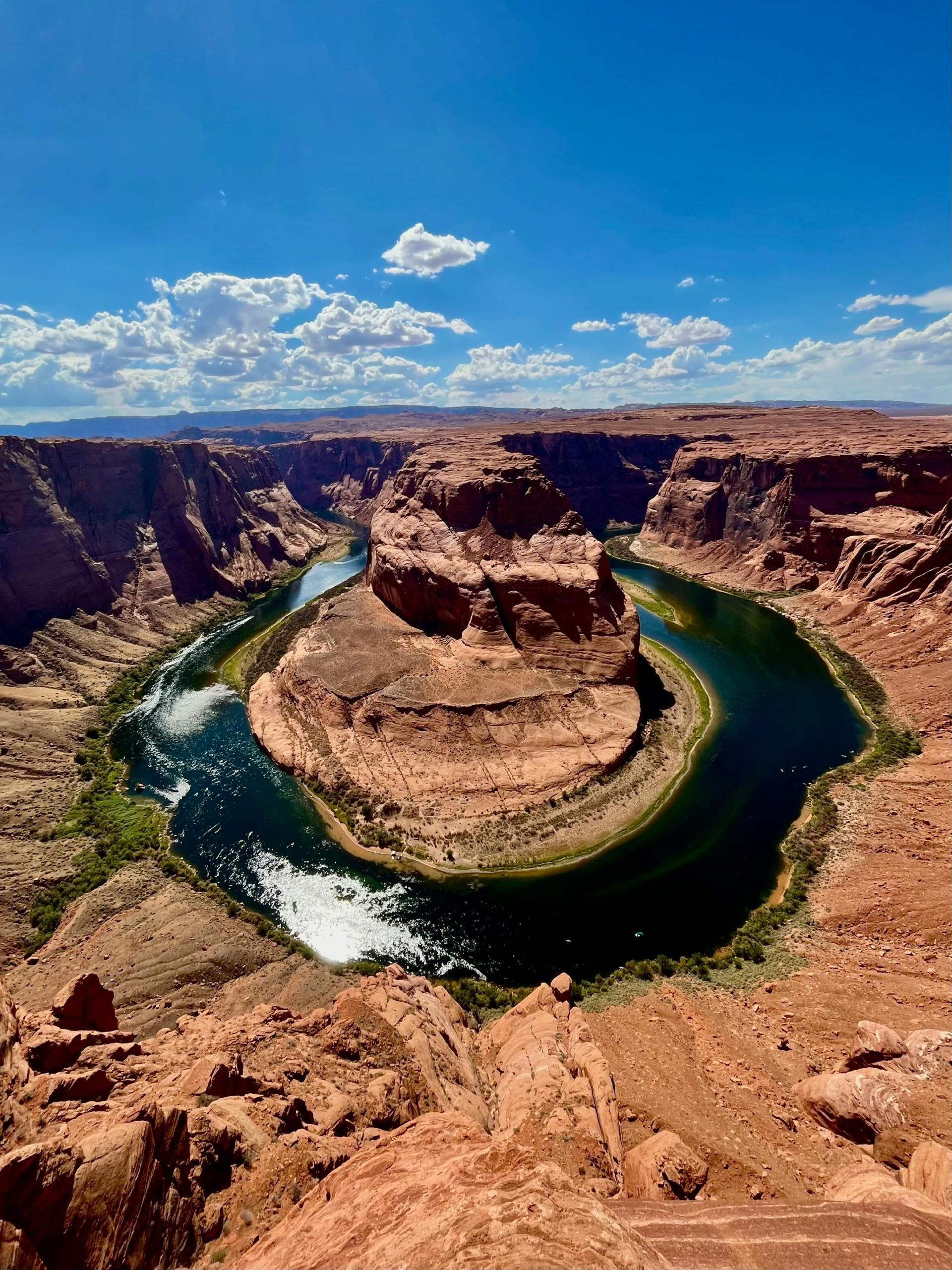 Lake in the middle of a canyon surrounded by rocks