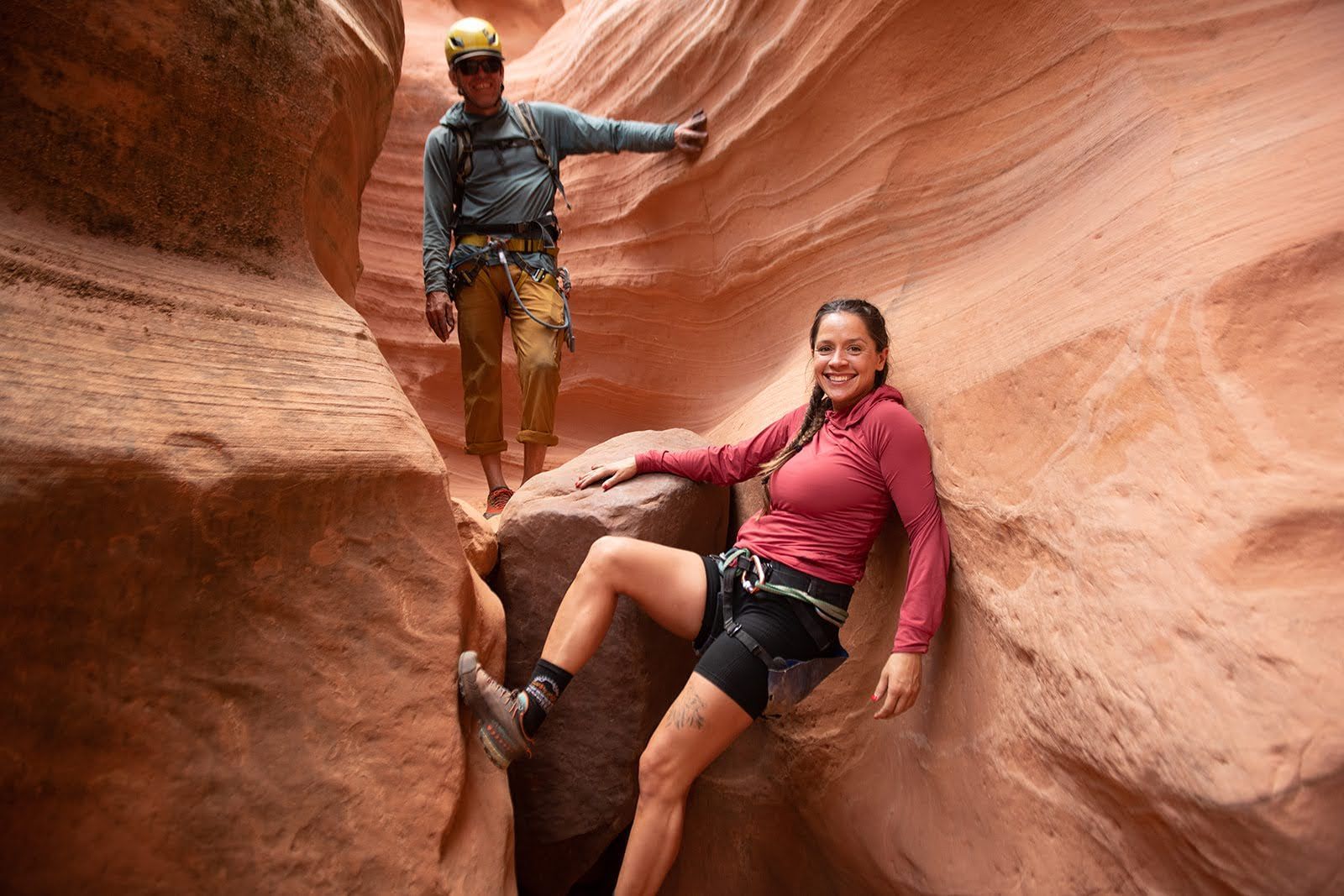 A group of people are hiking across a river.