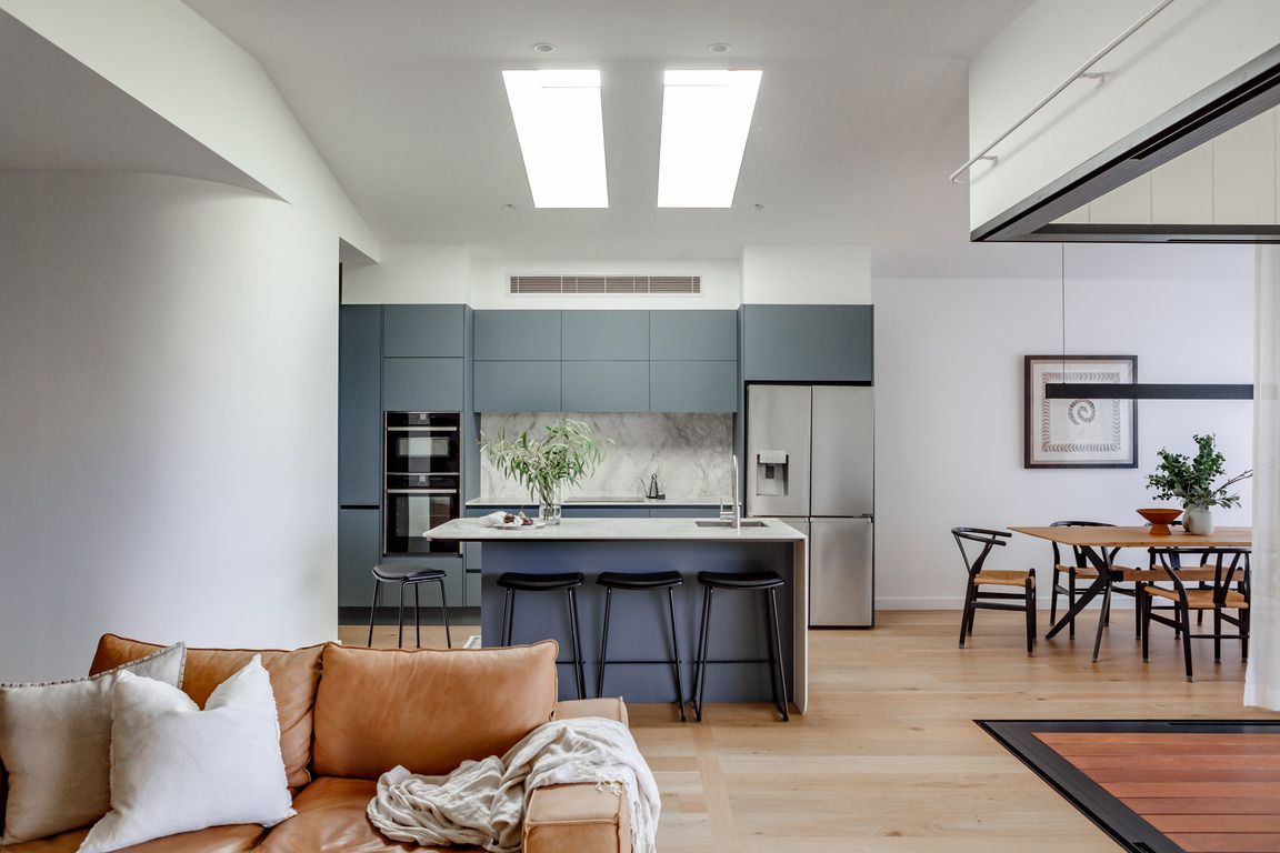 A Kitchen With White Cabinets And White Counter Tops — Lake Macquarie Designer Kitchens In Morisset, NSW