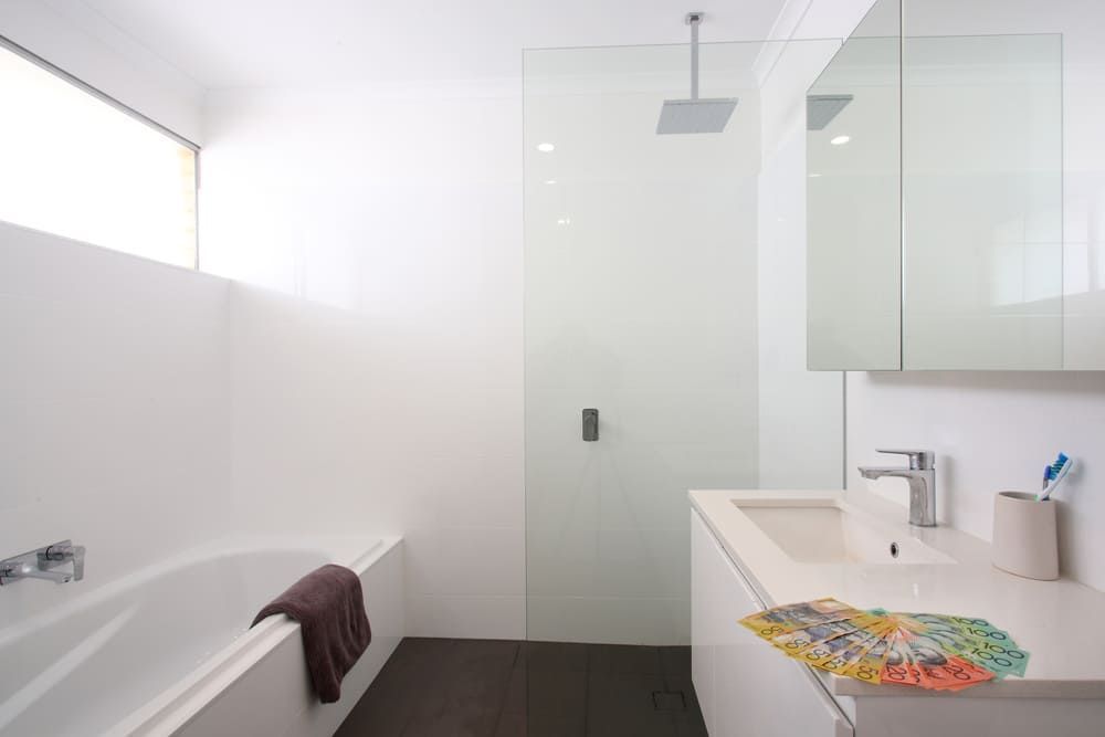 A Bathroom With A Bathtub, Sink And Shower — Lake Macquarie Designer Kitchens In Cooranbong, NSW