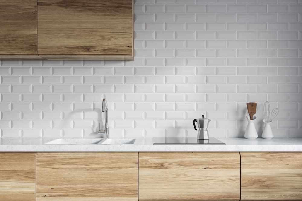 A Kitchen With White Brick Tiles — Lake Macquarie Designer Kitchens In Cooranbong, NSW
