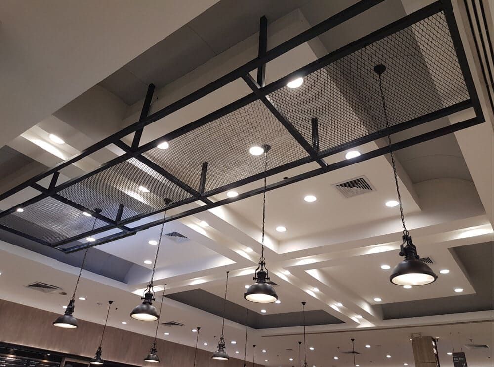 The Ceiling Of A Restaurant With Lots Of Lights Hanging From It — Lake Macquarie Designer Kitchens In Cooranbong, NSW