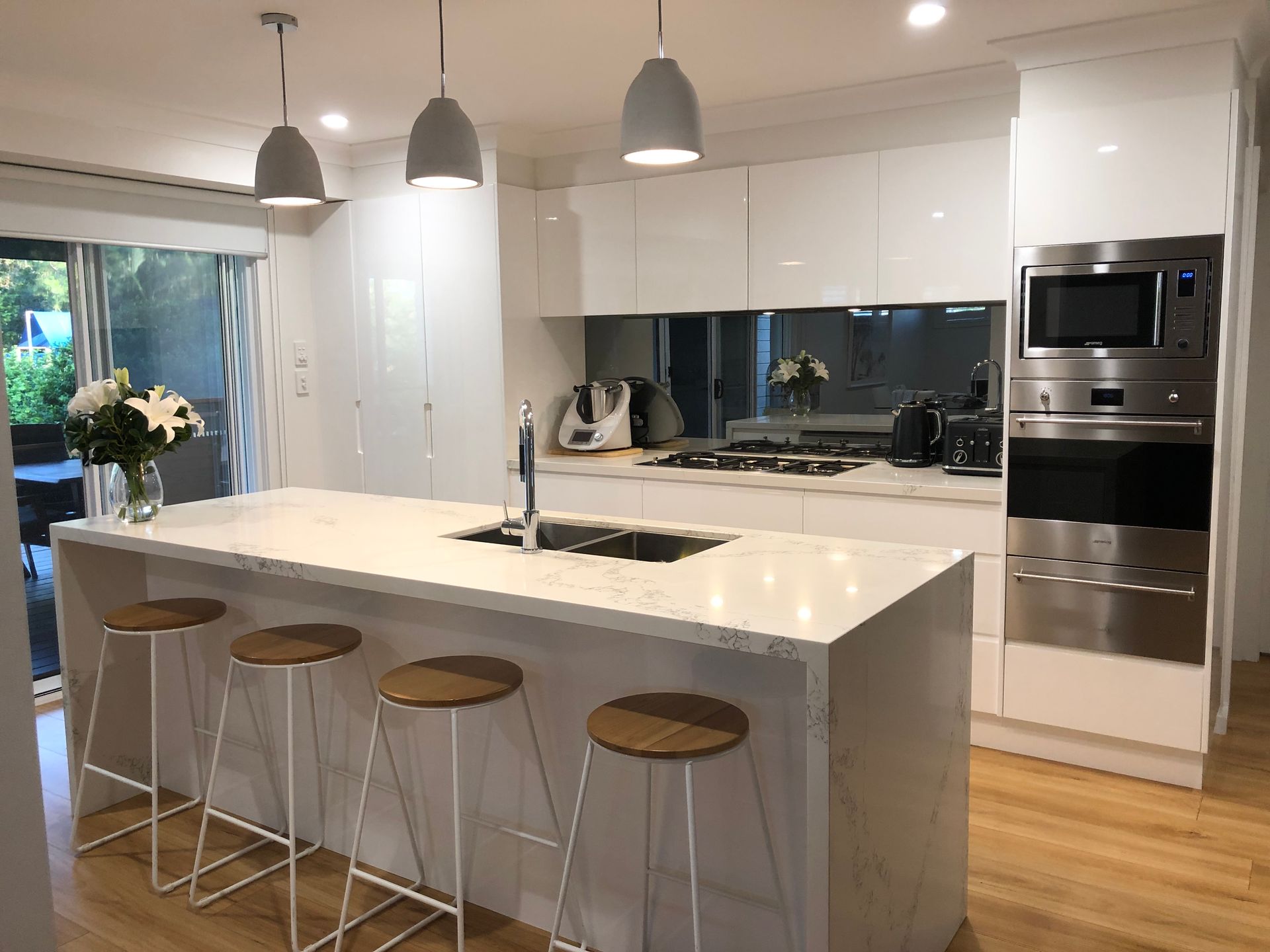 Modern Kitchen with Red Splashback — Lake Macquarie Designer Kitchens In Wangi Wangi, NSW